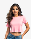Woman wearing a pink crop top and blue jeans on a white background